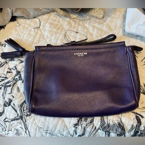 Never used, Coach, purple/plum wristlet wallet. Great condition.